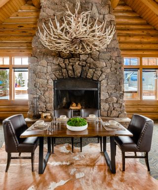 Dining room in Big Sky home rental owned by Conrad Anker with mountain view