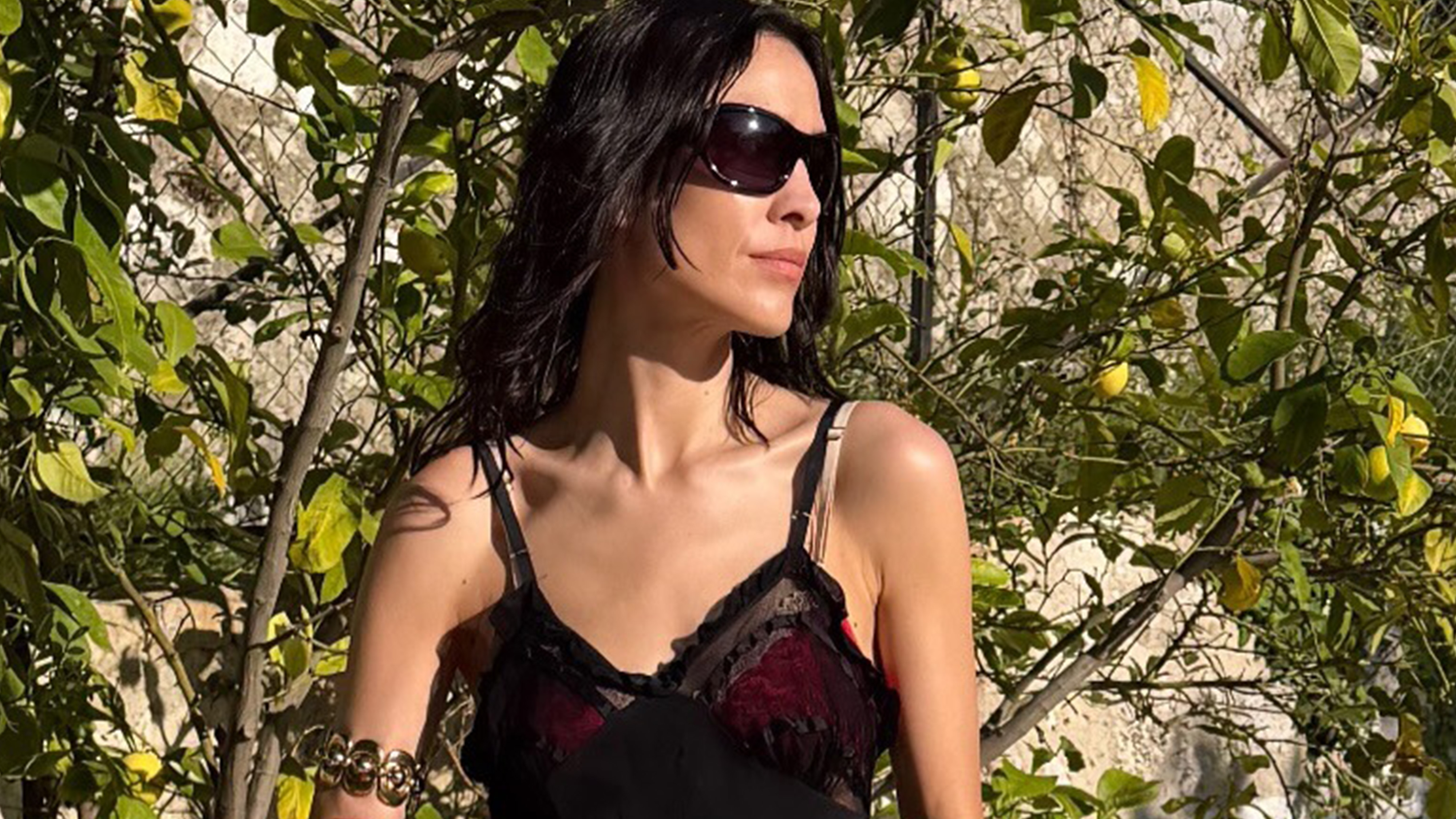 Alexa Chung wearing a black dress.