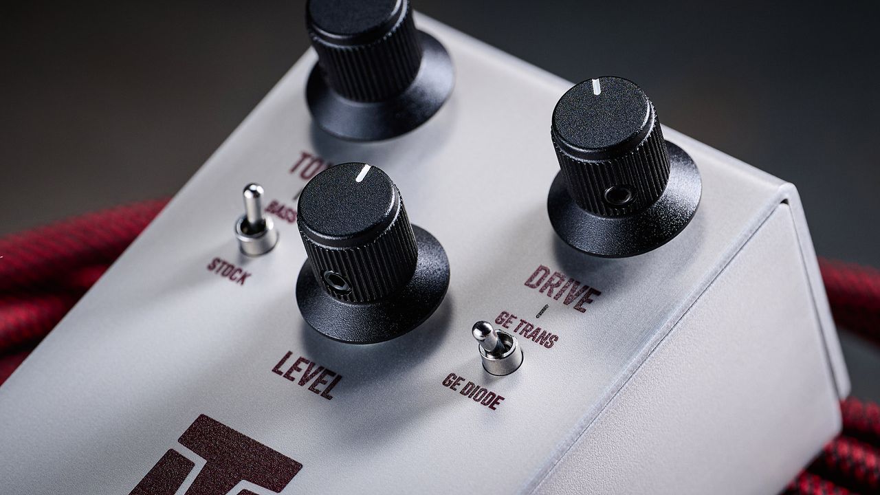 Keeley Electronics Manis: this ingenuous twist ont he K-style overdrive has three-knobs, a couple of mode switches, a tidy white finish and is photographed here against an amp with a red guitar cable.