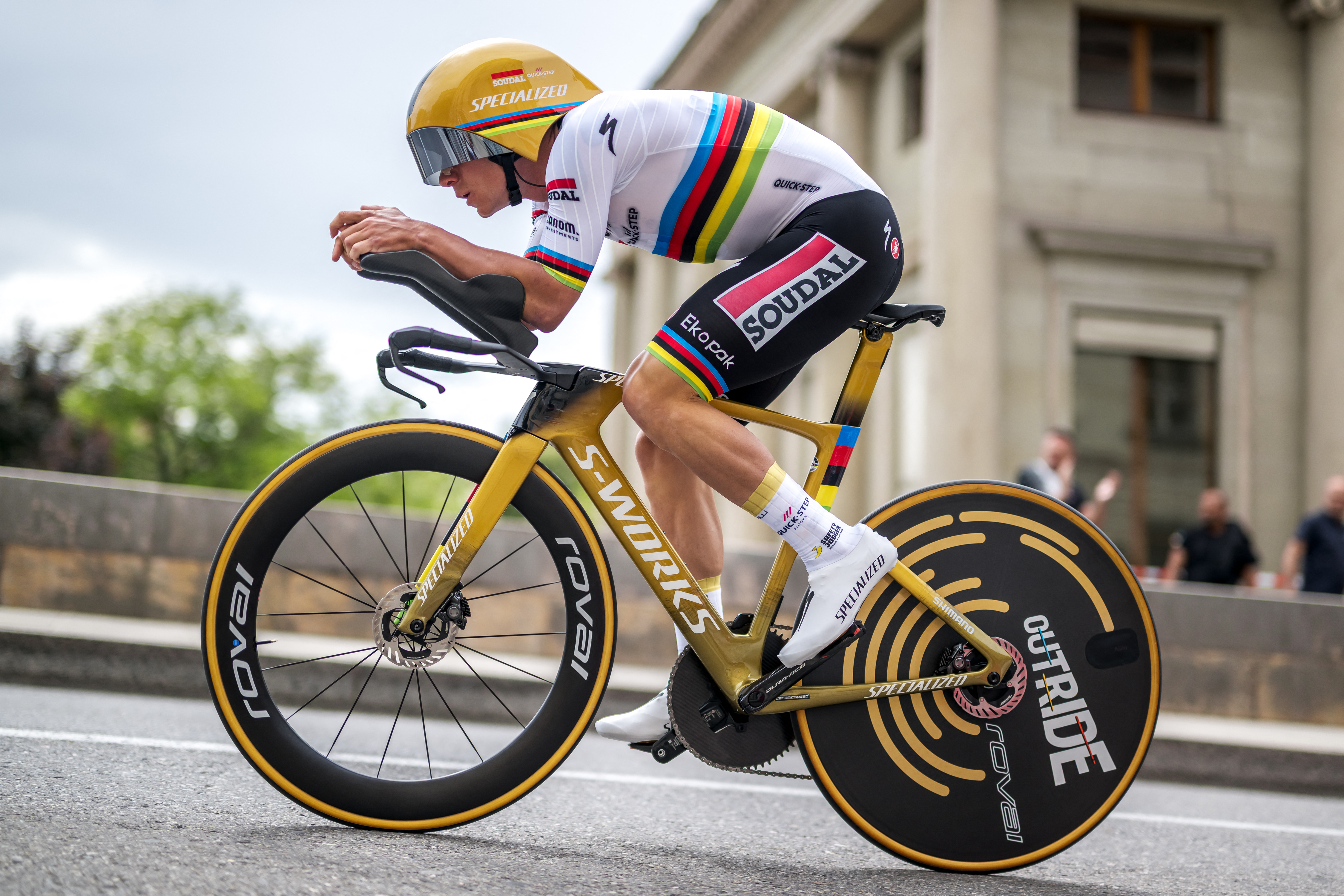 Remco Evenepoel riding a gold bike at the Tour de Romandie
