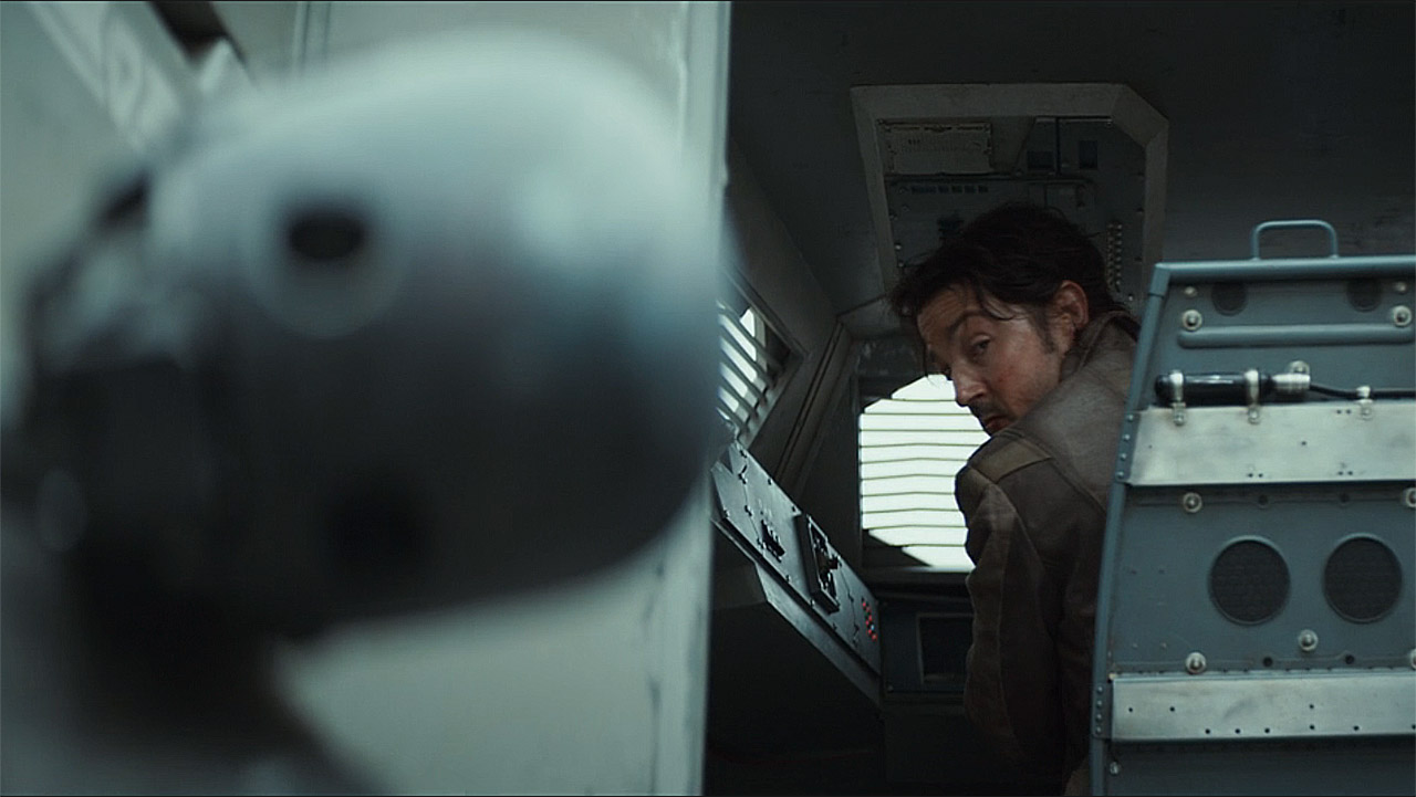 Cassian looking back at a broken KX droid in Andor season 2 episode 8