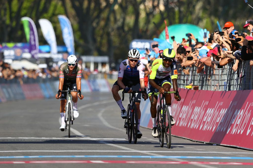 NAPOLI ITALY MAY 14 LR Mathieu Van Der Poel of Netherlands and Team Alpecin Fenix Mauro Schmid of Switzerland and Team QuickStep Alpha Vinyl and Hailu Biniam Girmay of Eritrea and Team Intermarch Wanty Gobert Matriaux cross the finishing line during the 105th Giro dItalia 2022 Stage 8 a 153km stage from Napoli to Napoli Giro WorldTour on May 14 2022 in Napoli Italy Photo by Michael SteeleGetty Images