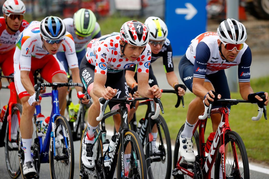 MRDEBRETAGNE GUERLDAN FRANCE JUNE 27 Edward Theuns of Belgium and Team Trek Segafredo Ide Schelling of The Netherlands and Team BORA Hansgrohe Polka Dot Mountain Jersey Anthony Perez of France and Team Cofidis Simon Clarke of Australia and Team Qhubeka NextHash Jrmy Cabot of France and Team Team TotalEnergies Jonas Koch of Germany and Team Intermarch Wanty Gobert Matriaux in breakaway during the 108th Tour de France 2021 Stage 2 a 1835km stage from PerrosGuirec to MrdeBretagne Guerldan 293m LeTour TDF2021 on June 27 2021 in MrdeBretagne Guerldan France Photo by Chris GraythenGetty Images