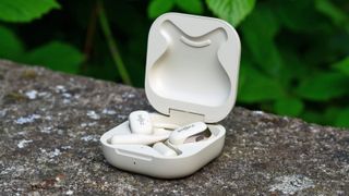 Shokz OpenFit earphones in their charging case