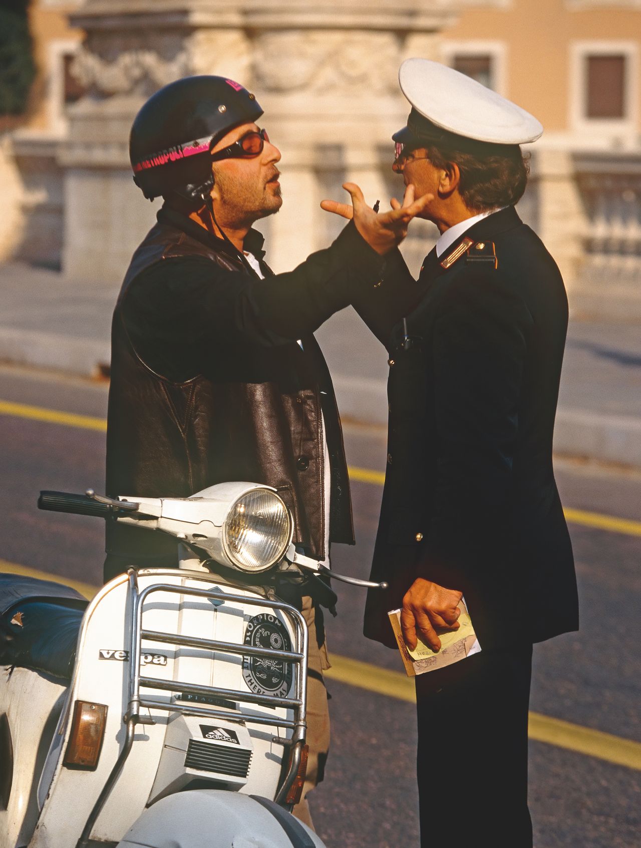 Moped rider arguing with a police man in Rome