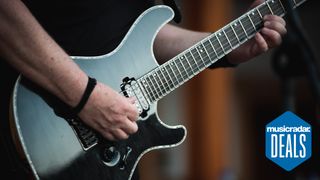 Close up of a person playing guitar