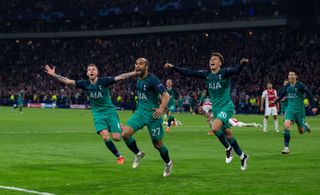 Lucas Moura of Tottenham Hotspur celebrates, with teammates Toby Alderweireld and Dele Alli, after scoring the winning goal against Ajax in the second leg of the 2018/19 UEFA Champions League semi-final at the Johan Cruijff ArenA in Amsterdam, May 2019