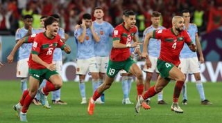 Morocco players celebrate after defeating Spain on penalties during the FIFA World Cup Qatar 2022 Round of 16 match between Morocco and Spain at Education City Stadium on December 06, 2022 in Al Rayyan, Qatar.