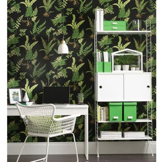 home office room with black and green plant wallpaper