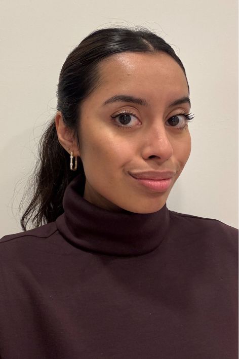 Ruby Ford-Dunker testing the Saie Dew Bronze Soft-Focus Sculpting Liquid Bronzer.