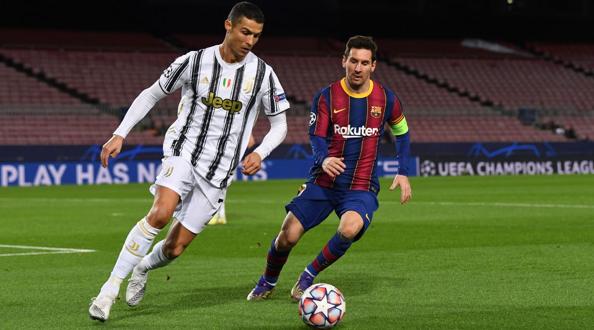 Cristiano Ronaldo of Juventus and Lionel Messi of Barcelona challenge for the ball during the UEFA Champions League group stage match between Barcelona and Juventus on 8 December, 2020 at the Camp Nou in Barcelona, Catalonia, Spain.