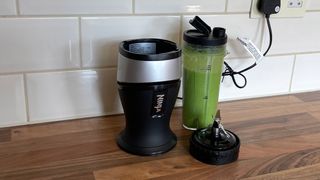 Ninja Personal Blender and Smoothie Maker QB3001 filled with a msoothie created by blending fruit and vegetables