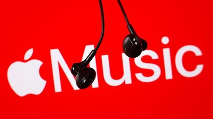The Apple Music logo on a red background with wired headphones hanging down