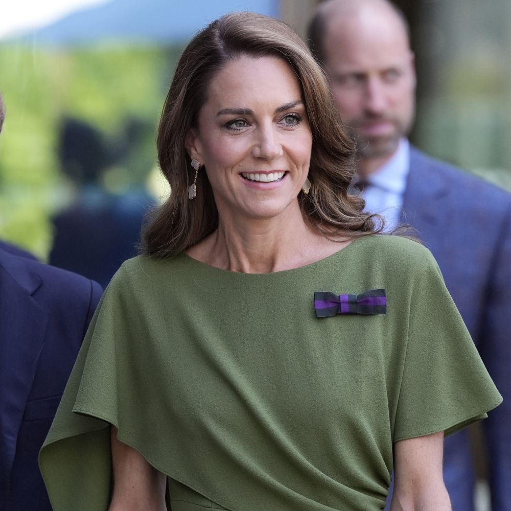 Kate Middleton wears an olive green dress with brown heels and a brown DeMellier bag at Wimbledon.
