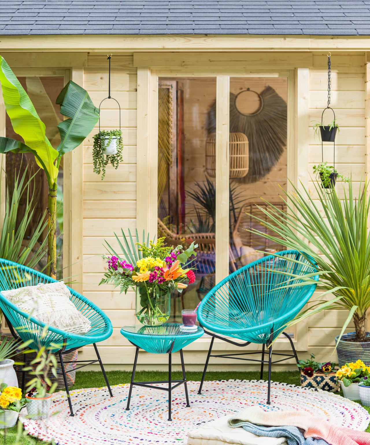 Maximalist outdoor living room with colourful garden bistro set