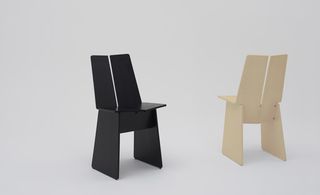 'Laurus' chair, by Taiji Fujimori of Commoc, for the J Style exhibition of Japanese design. Two chairs a black one and one with a wood finish.