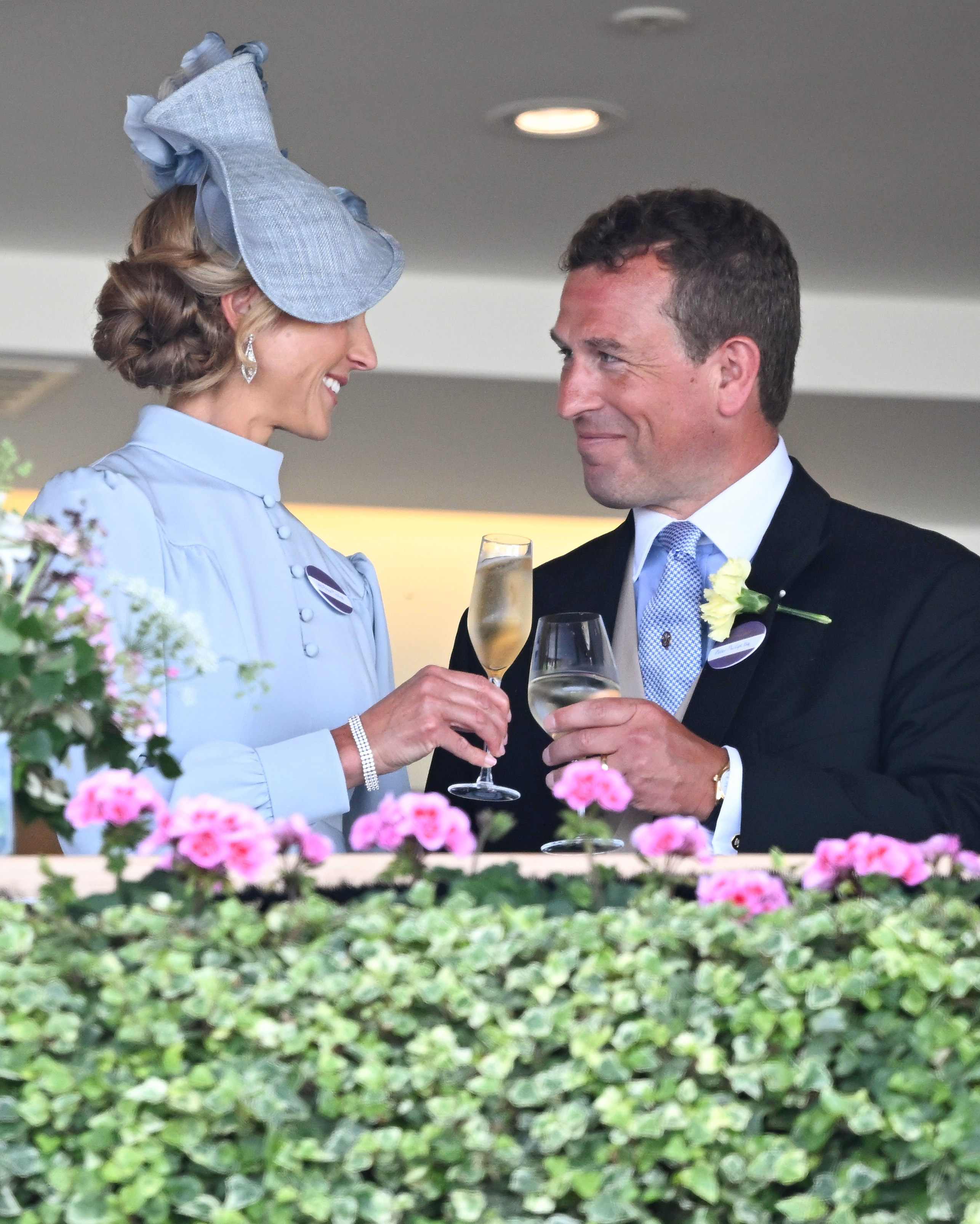 ASCOT, ENGLAND - JUNE 16: Harriet Phillips and Peter Phillips smile and drink champagne as they attend day one of Royal Ascot 2026 at Ascot Racecourse on June 16, 2026 in Ascot, England. (Photo by Samir Hussein/WireImage)