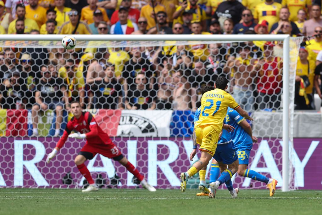 Nicolae Stanciu of Romania scores the opening goal during the UEFA EURO 2024 group stage match between Romania and Ukraine at Munich Football Arena on June 17, 2024 in Munich, Germany. 