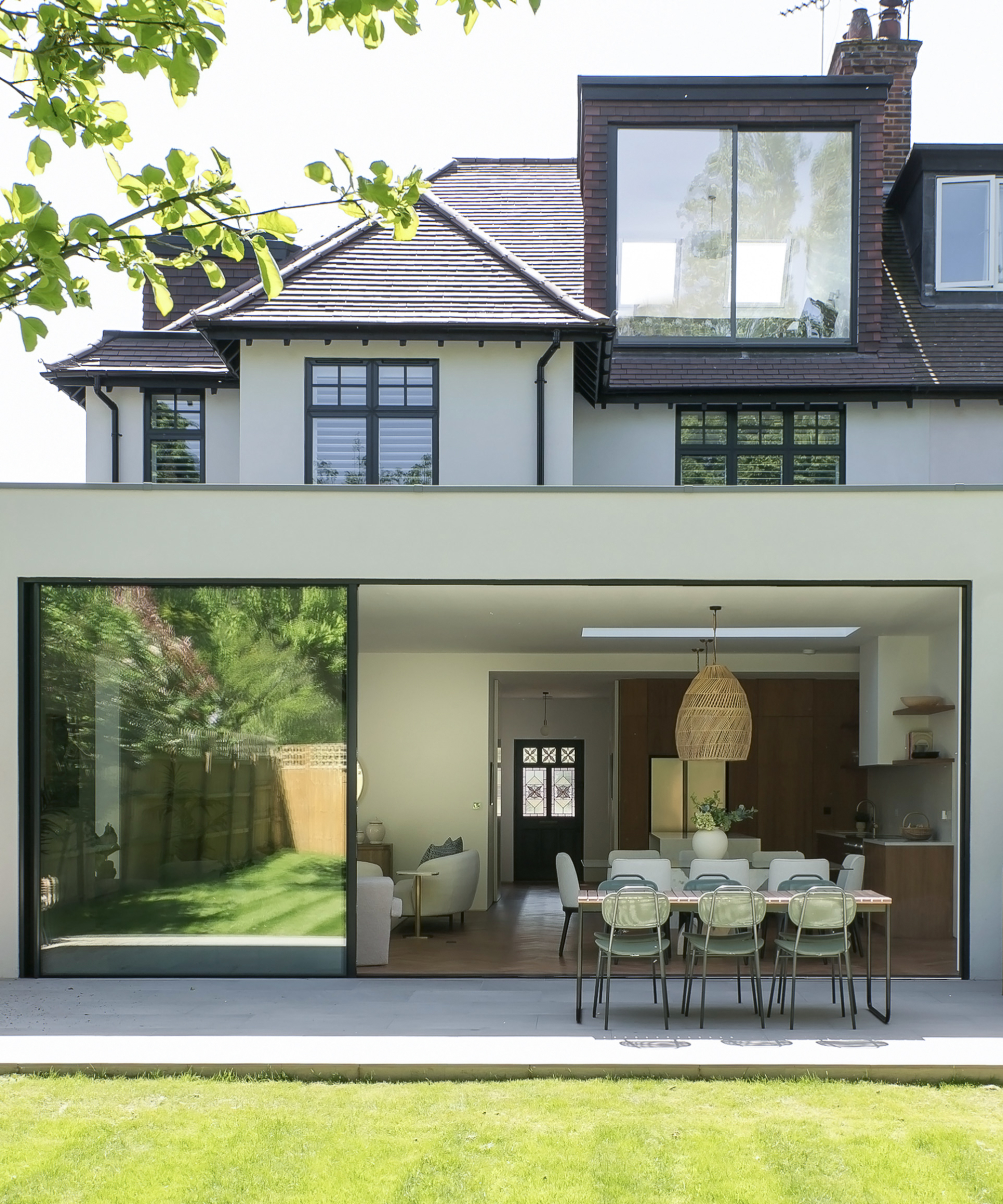 semi detached edwardian house with modern dormer loft conversion with picture window and modern rear extension with large sliding patio doors
