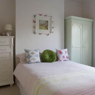 bedroom with white wall and green wardrobe