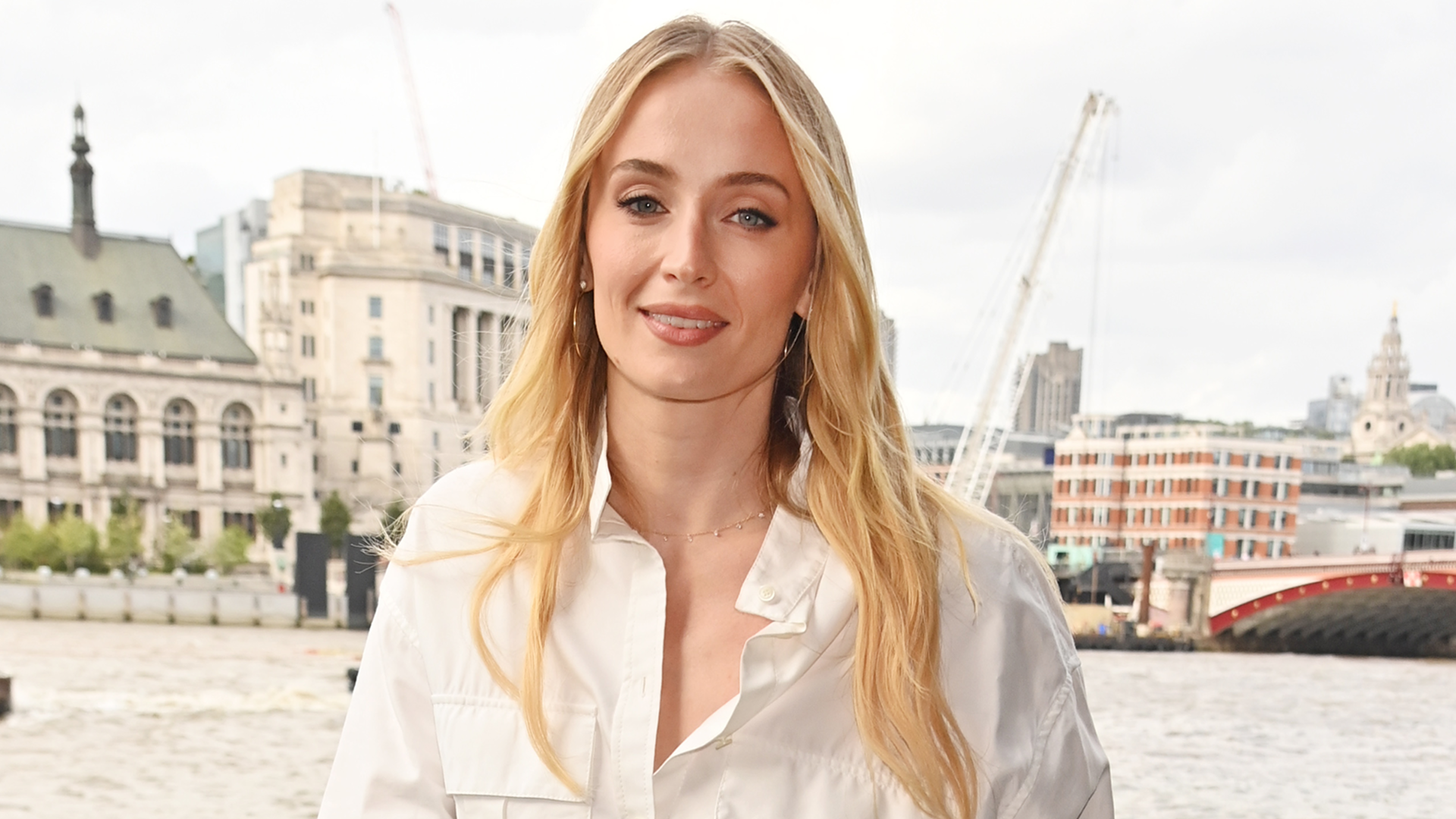 Sophie Turner styled a white shirt dress in London at a Hugo Spritz event.