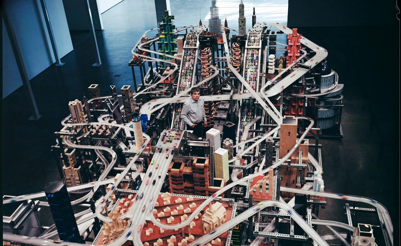 Chris Burden is standing in the middle of his kinetic sculpture representing Los Angeles.