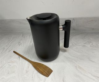 Fellow Clara French Press unboxed on a countertop with the agitator