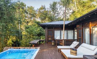 Wrap-around wooden deck with its own plunge pool