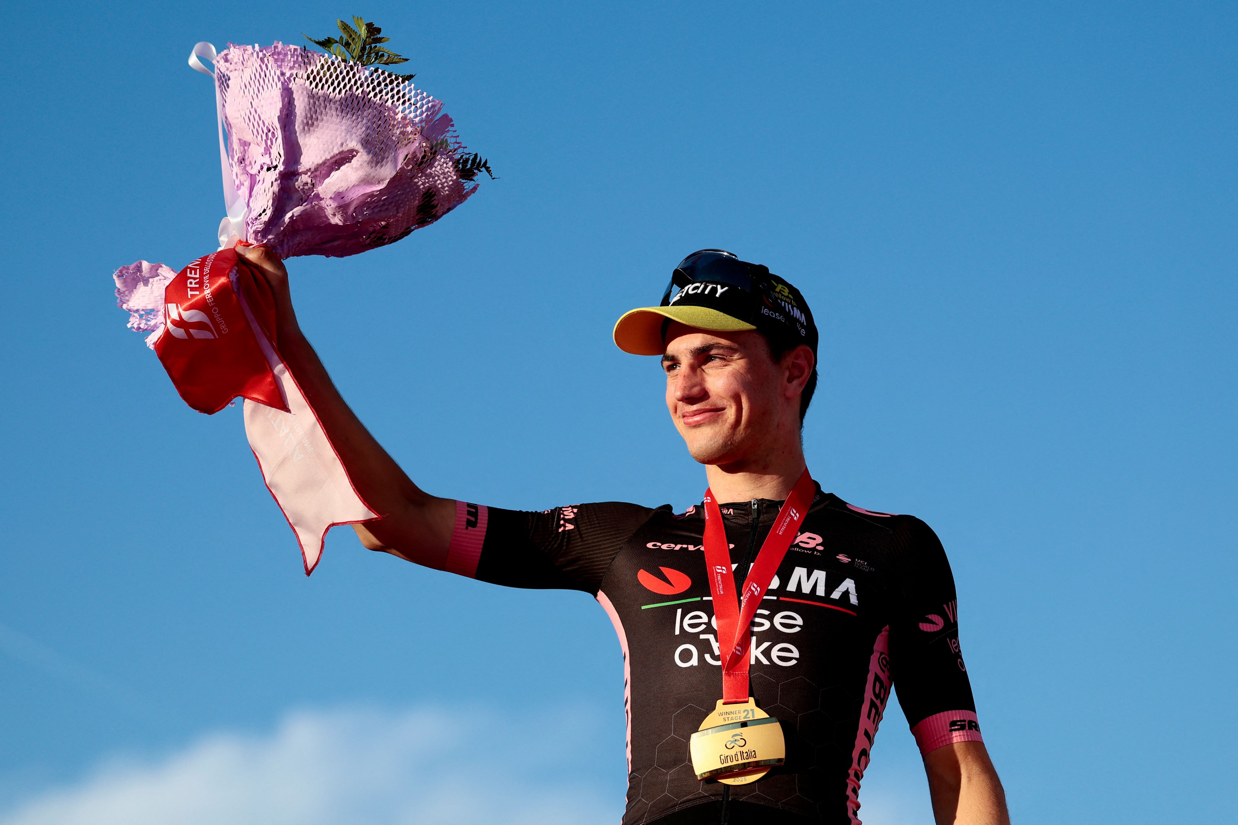 Olav Kooij celebrates stage 21 victory at the Giro d'Italia 2025