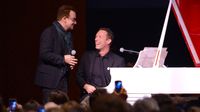 Bono (L) and Chris Martin perform on stage at Sotheby's during the 2013 (RED) Auction Celebrating Masterworks Of Design and Innovation on November 23, 2013 in New York City