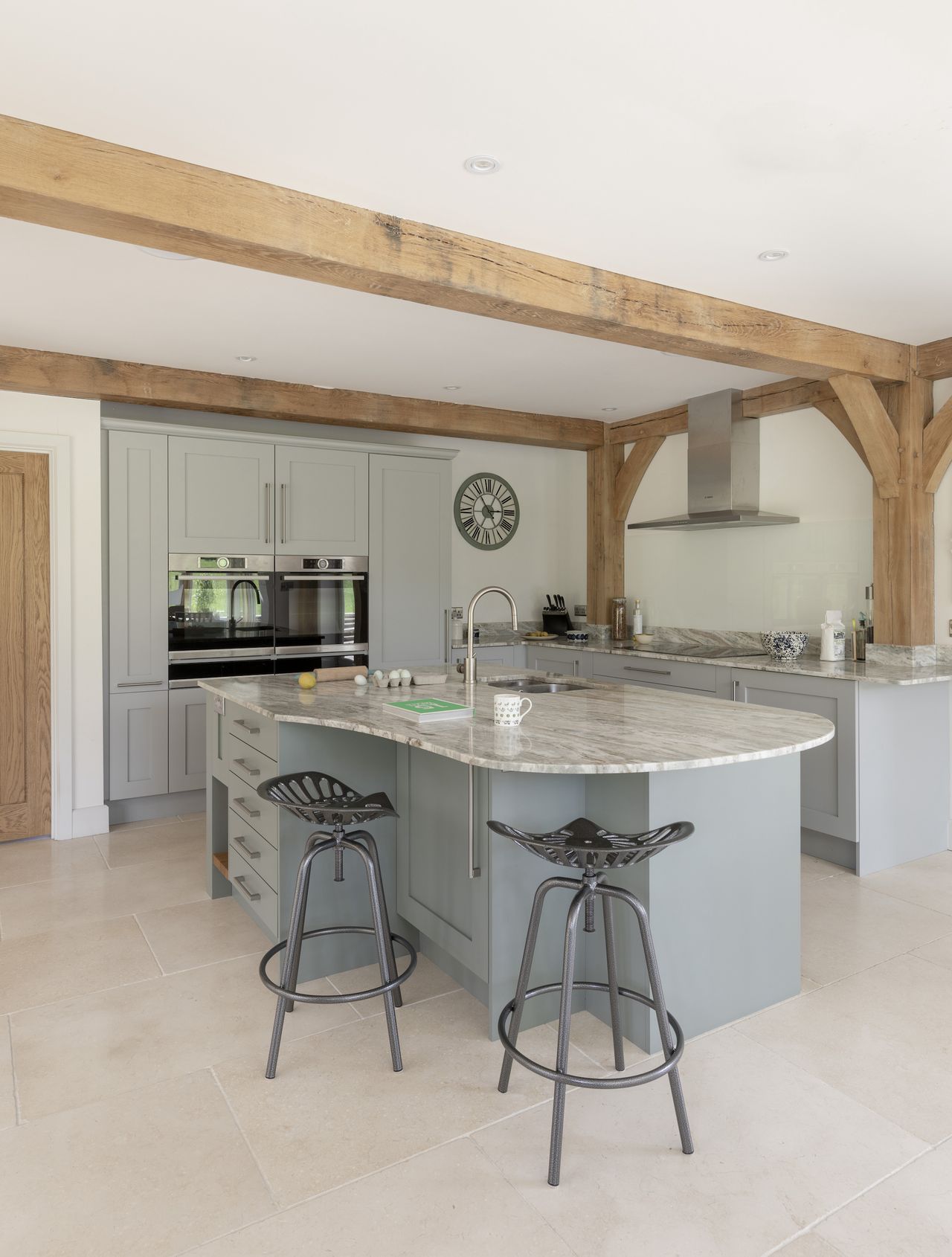 blue and grey kitchen in oak frame home