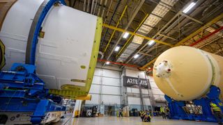 The engine section and the core stage of NASA's Space Launch System rocket that will launch the crewed Artemis 2 mission to the moon next year are being put together.