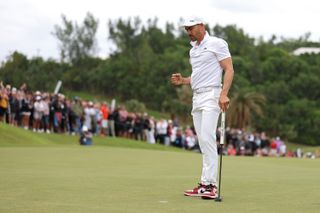 Camilo Villegas fist pumps after holing the winning putt at the Butterfield Bermuda Championship