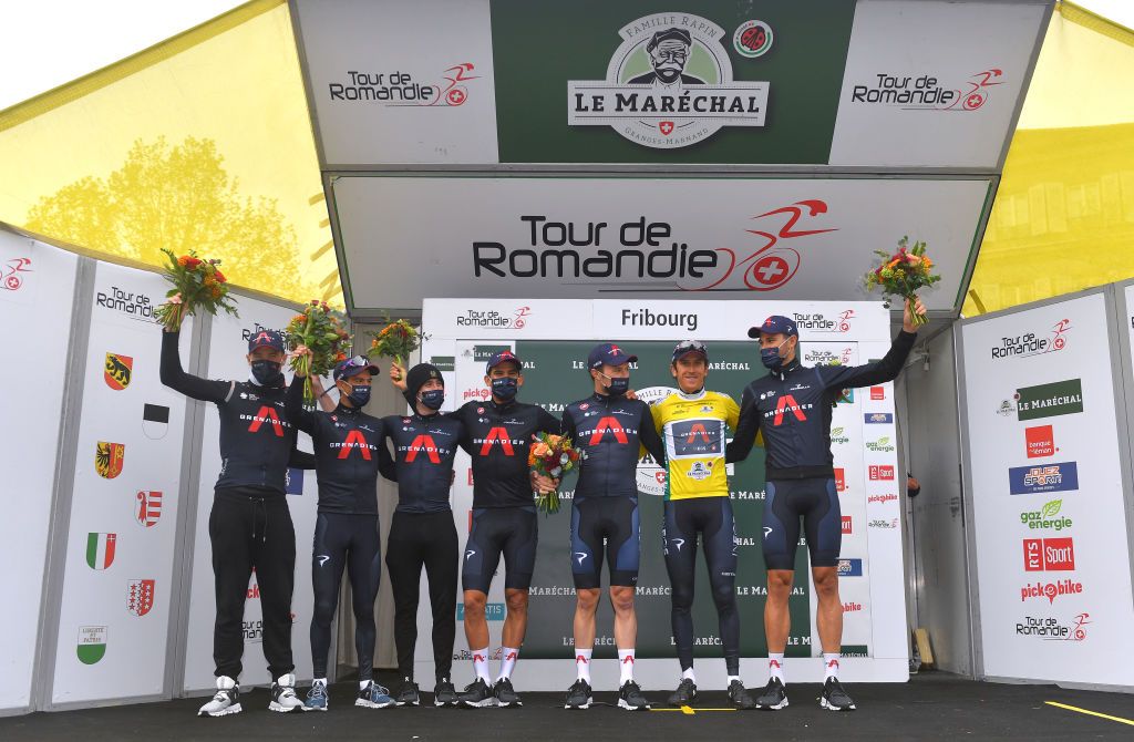 FRIBOURG SWITZERLAND MAY 02 Geraint Thomas of The United Kingdom Yellow Leader Jersey Andrey Amador Bikkazakova of Costa Rica Rohan Dennis of Australia Owain Doull of United Kingdom Eddie Dunbar of Ireland Filippo Ganna of Italy Richie Porte of Australia and Team INEOS Grenadiers celebrate Best Team Trophy at podium during the 74th Tour De Romandie 2021 Stage 5 a 1619km Individual Time Trial stage from Fribourg to Fribourg 614m ITT TDR2021 TDRnonstop UCIworldtour on May 02 2021 in Fribourg Switzerland Photo by Luc ClaessenGetty Images