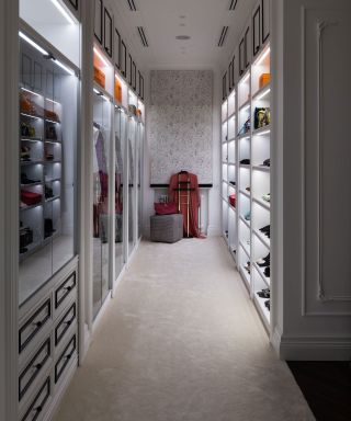 narrow white walk-in closet