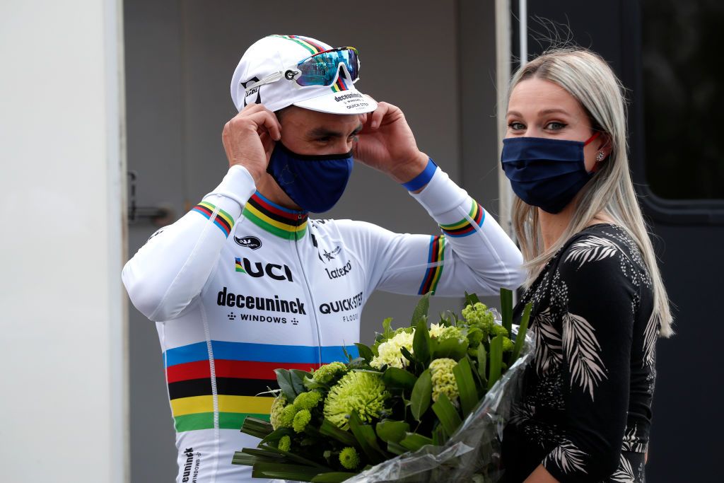 MUR DE HUY BELGIUM APRIL 21 Podium Julian Alaphilippe of France and Team Deceuninck QuickStep Marion Rousse of France Girlfriend ExPro riderTV Journalist during the 85th La Fleche Wallonne 2021 Men Elite a 1936km race from Charleroi to Mur de Huy 204m Mask Covid safety measures Flowers Girlfriend FlecheWallonne on April 21 2021 in Mur de Huy Belgium Photo by Bas CzerwinskiGetty Images
