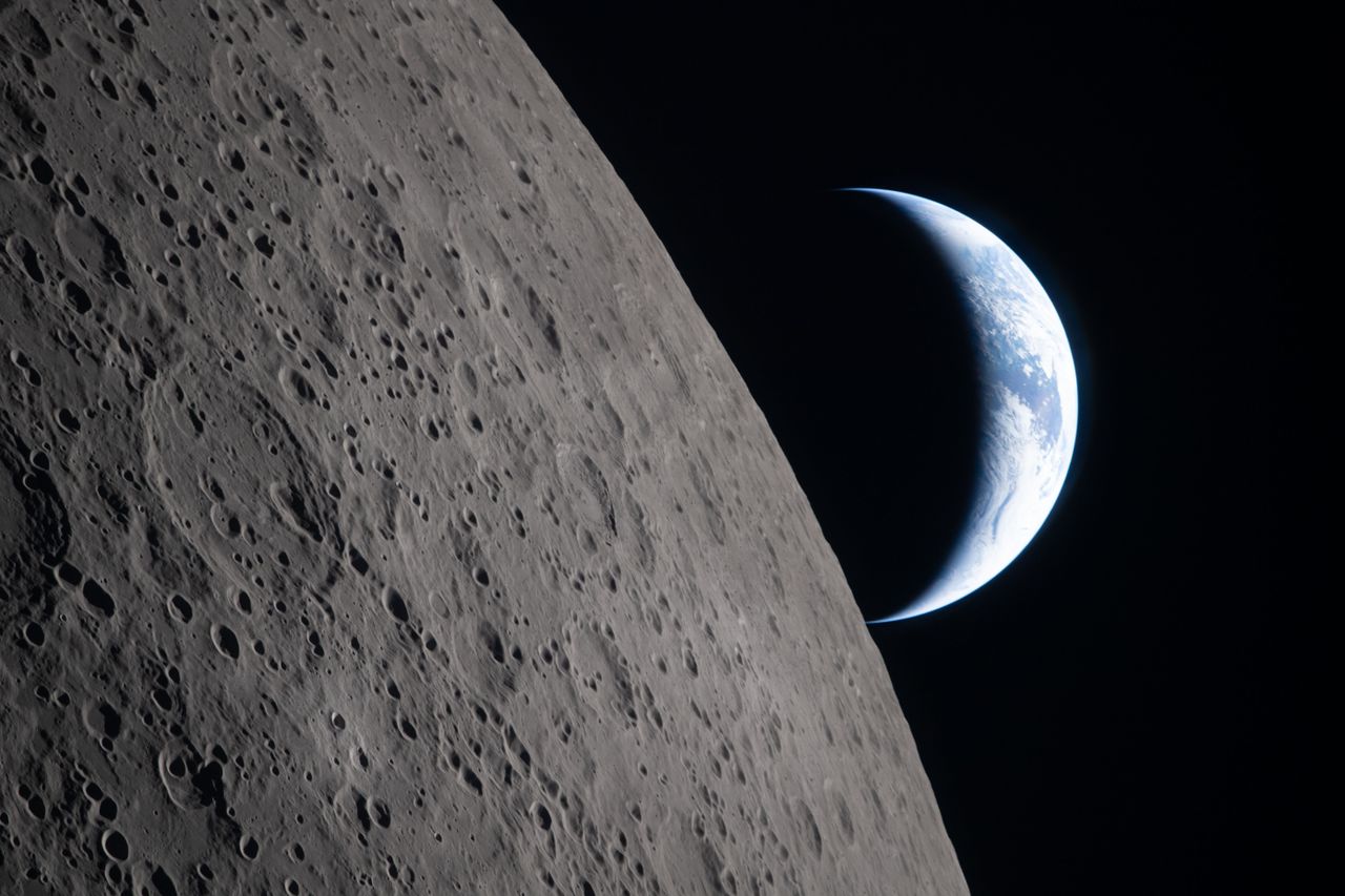 A photograph of the moon and Earth taken from Artemis II