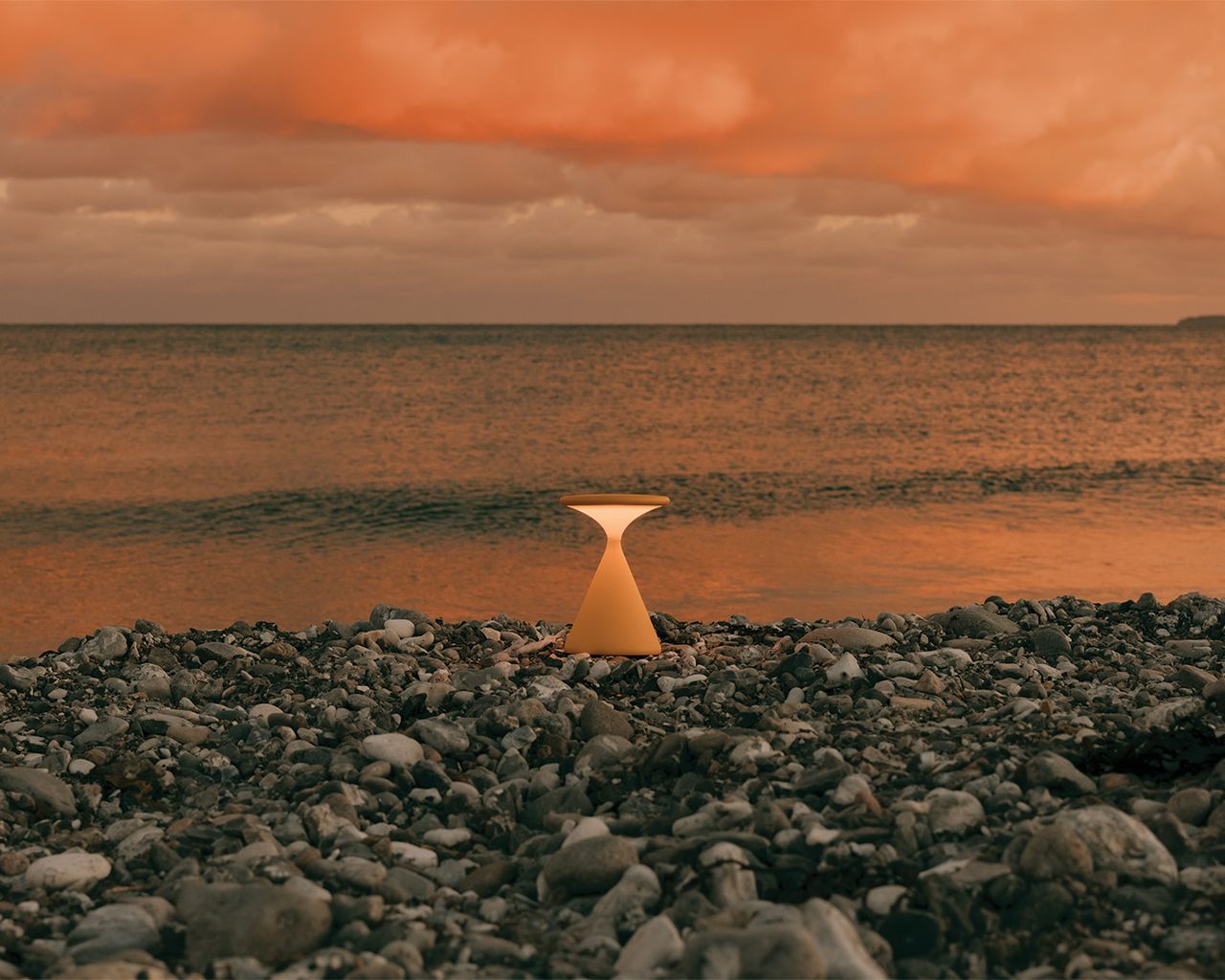 Portable lights on the beach at sunset