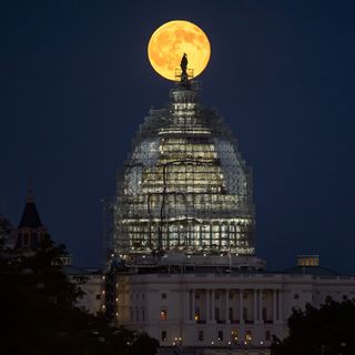 The second full moon of July 2015, a so-called Blue Moon, rises behind the dome of the U.S. Capitol in this amazing view by NASA photographer Bill Ingalls in Washington, D.C. on July 31, 2015.