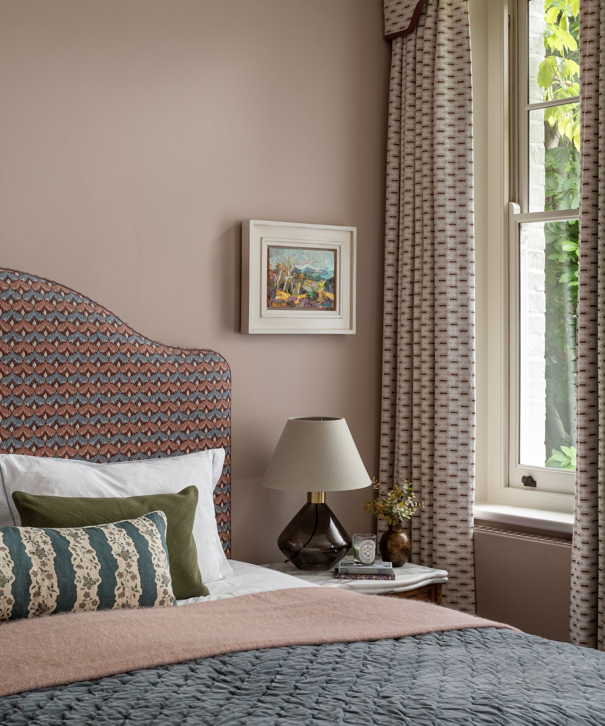 A bedroom with walls painted in Dead Salmon, Farrow & Ball