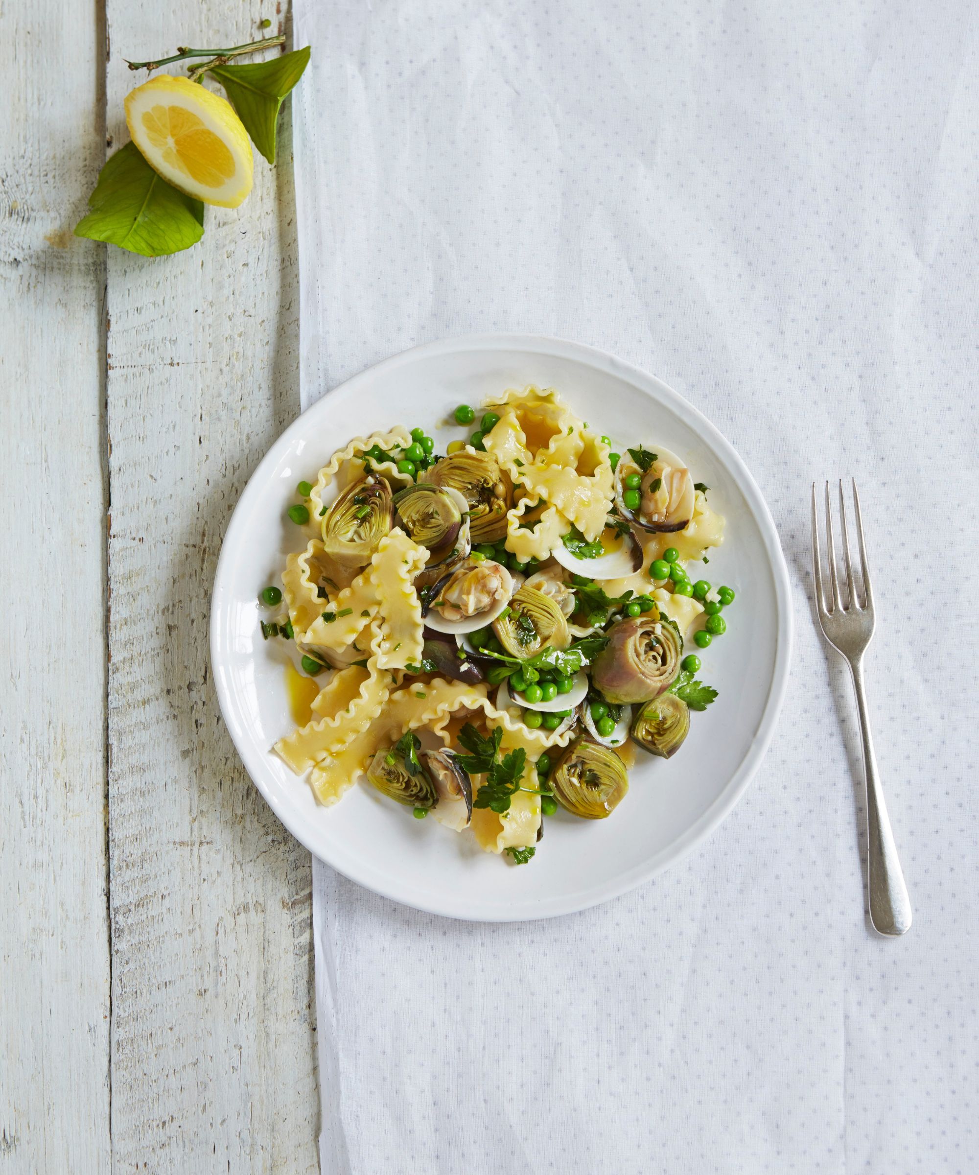 Malfadine with artichokes, pea, clams and white wine
