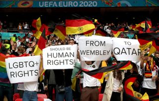 Germany fans hold up signs in relation to LGBTQ+ rights