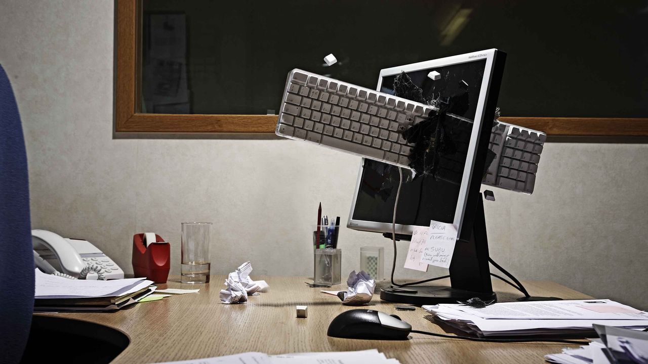 A keyboard is thrown through a monitor