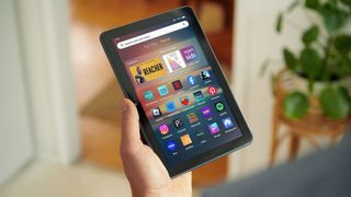 Amazon Fire HD 8 (2024) lifestyle render holding tablet in hand