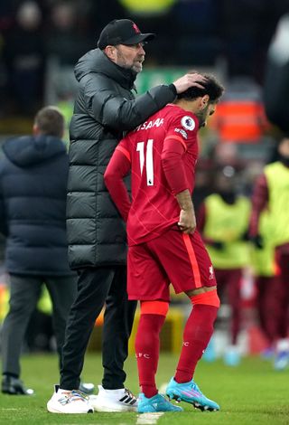 Liverpool manager Jurgen Klopp consoles Mohamed Salah