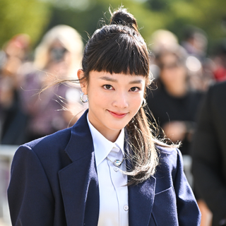 A guest at Paris Fashion Week SS25 Beauty Street Style wearing a micro-fringe