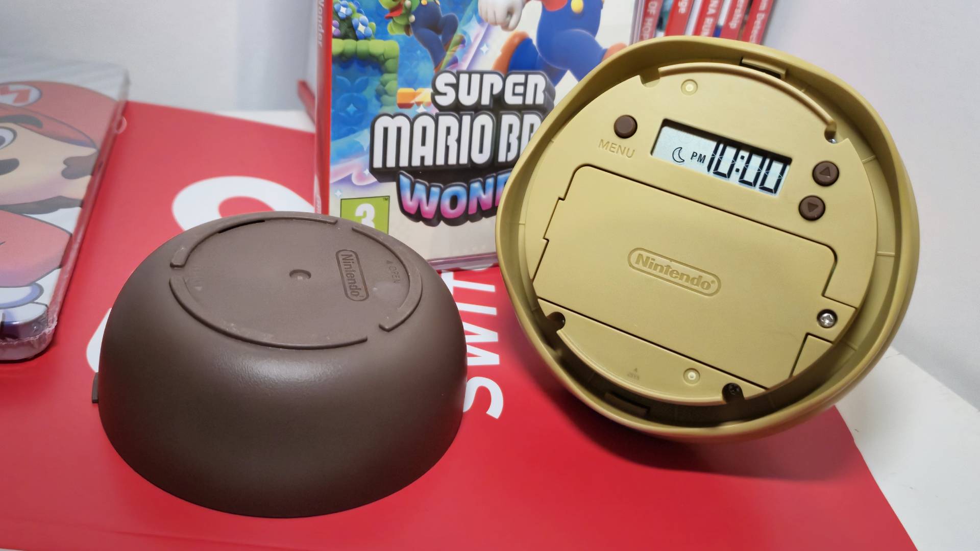 Photo of the back of the Talking Flower toy with the digital clock component showing 10PM on its screen.