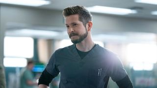 Matt Czuchry looks at something off screen