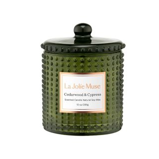A textured green candle jar