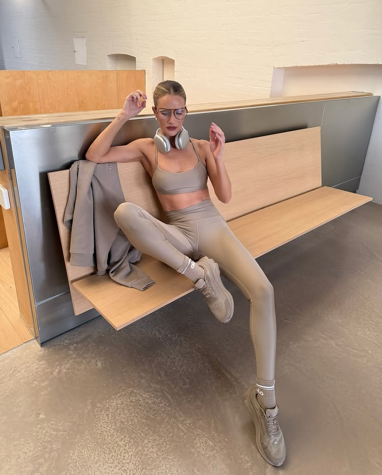 An image of metallic leggings, one of the biggest leggings trends for 2026, with a matching bralette and shoes.